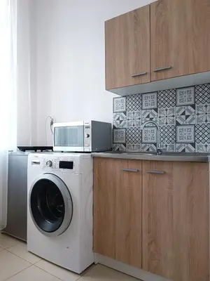 Kuchnia lub aneks kuchenny w obiekcie Przytulne 2-pokojowe apartamenty niedaleko Starego Miasta Lok 17