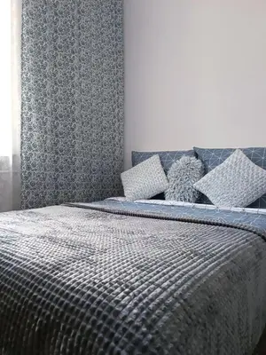 Łóżko lub łóżka w pokoju w obiekcie Przytulne 2-pokojowe apartamenty niedaleko Starego Miasta Lok 17