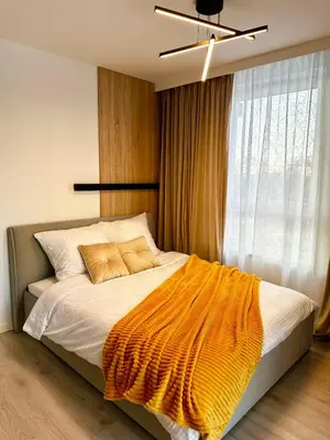 Łóżko lub łóżka w pokoju w obiekcie Modern space apartment