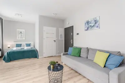 Łóżko lub łóżka w pokoju w obiekcie Warsaw City Apartments Praga