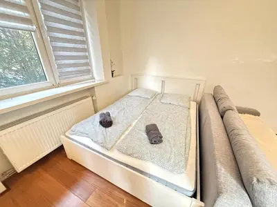 Łóżko lub łóżka w pokoju w obiekcie YOURAPART Anielewicza