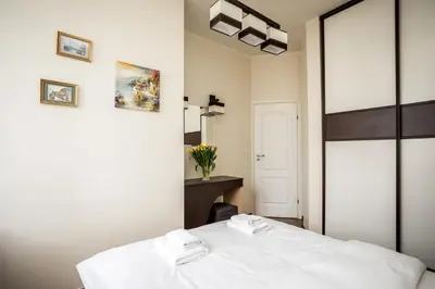 Łóżko lub łóżka w pokoju w obiekcie Apartamenty Wawa Centrum by Your Freedom