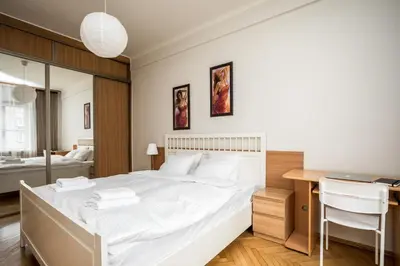 Łóżko lub łóżka w pokoju w obiekcie Apartamenty Wawa Centrum by Your Freedom