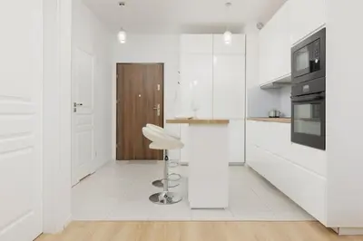 Kuchnia lub aneks kuchenny w obiekcie Apartment with AC Warsaw Mokotów Business Centre by Noclegi Renters