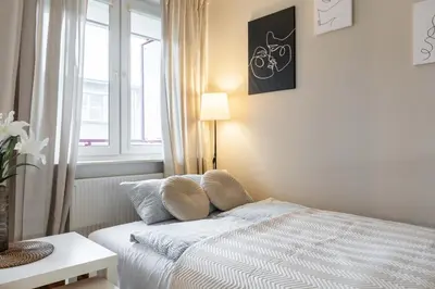 Łóżko lub łóżka w pokoju w obiekcie Goldenberry apartment Mokotow
