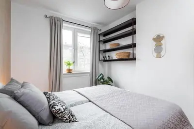 Łóżko lub łóżka w pokoju w obiekcie Goldenberry apartment Mokotow
