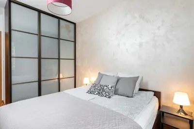 Łóżko lub łóżka w pokoju w obiekcie Goldenberry apartment Mokotow