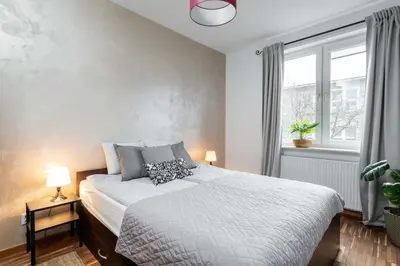 Łóżko lub łóżka w pokoju w obiekcie Goldenberry apartment Mokotow