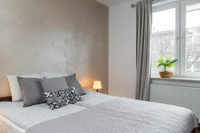 Łóżko lub łóżka w pokoju w obiekcie Goldenberry apartment Mokotow