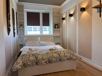 Łóżko lub łóżka w pokoju w obiekcie Apartament z Basenem w centrum Warszawy