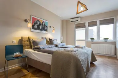 Łóżko lub łóżka w pokoju w obiekcie P&O City Center Apartments