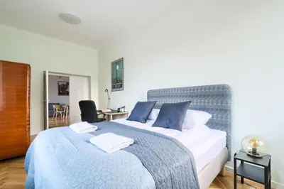 Łóżko lub łóżka w pokoju w obiekcie P&O City Center Apartments