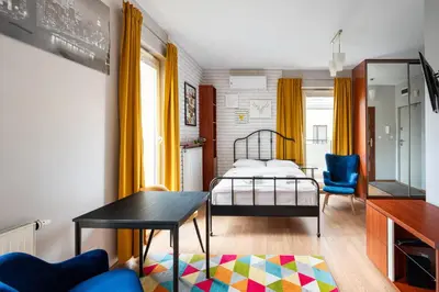 Łóżko lub łóżka w pokoju w obiekcie Warszawa Gocławek Comfort Studio by BookingHost
