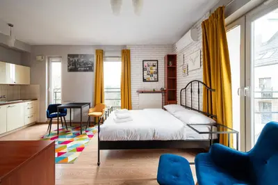 Łóżko lub łóżka w pokoju w obiekcie Warszawa Gocławek Comfort Studio by BookingHost