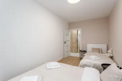 Łóżko lub łóżka w pokoju w obiekcie Warsaw City Family Premium