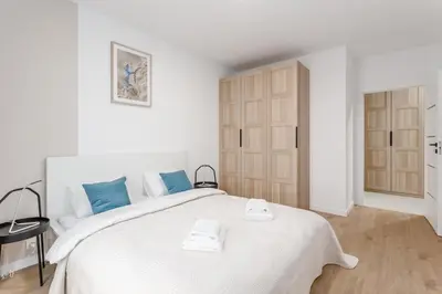 Łóżko lub łóżka w pokoju w obiekcie Warsaw City Family Premium