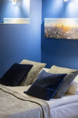 Łóżko lub łóżka w pokoju w obiekcie Comfortable Studio Sapiezynska by Noclegi Renters
