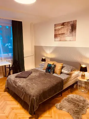 Łóżko lub łóżka w pokoju w obiekcie ClickTheFlat Karmelicka Apart Rooms
