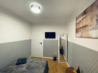 Telewizja i/lub zestaw kina domowego w obiekcie ClickTheFlat Karmelicka Apart Rooms