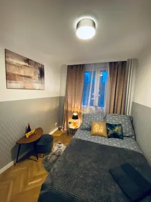 Łóżko lub łóżka w pokoju w obiekcie ClickTheFlat Karmelicka Apart Rooms