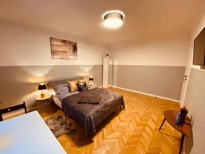 Łóżko lub łóżka w pokoju w obiekcie ClickTheFlat Karmelicka Apart Rooms