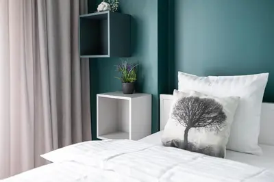 Łóżko lub łóżka w pokoju w obiekcie RentPlanet - Apartamenty Kasprzaka