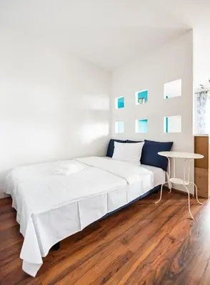 Łóżko lub łóżka w pokoju w obiekcie Ceramiczna Comfort Studio by BookingHost