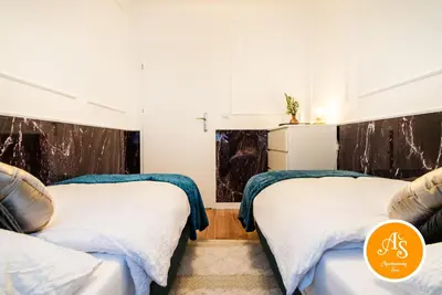 Łóżko lub łóżka w pokoju w obiekcie ApartamentySnu, Wola Komfort IV z parkingiem
