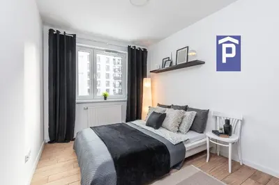 Łóżko lub łóżka w pokoju w obiekcie SuperApart Habicha apt77 - Blisko PKP i Factory Ursus