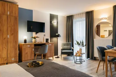 Telewizja i/lub zestaw kina domowego w obiekcie ORSO Rooms & Apartments by StayLab