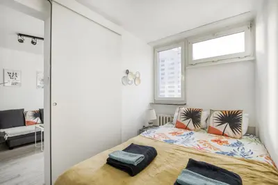 Łóżko lub łóżka w pokoju w obiekcie Central Apartment Rondo ONZ