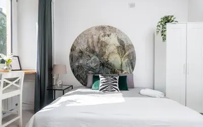 Łóżko lub łóżka w pokoju w obiekcie Urban Escape Studio Koszykowa