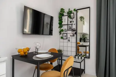 Telewizja i/lub zestaw kina domowego w obiekcie Urban Escape Studio Koszykowa