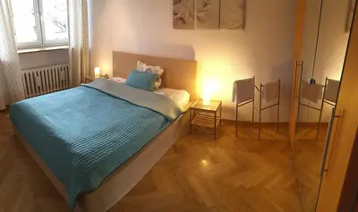 Łóżko lub łóżka w pokoju w obiekcie Wilson Apartment