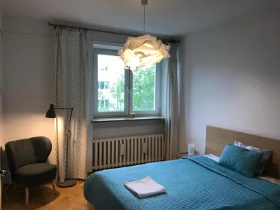 Łóżko lub łóżka w pokoju w obiekcie Wilson Apartment