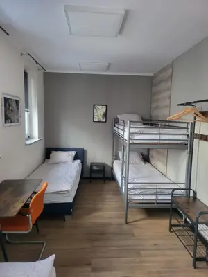 Łóżko lub łóżka w pokoju w obiekcie Rooms4Rest Bokserska - Private rooms for tourists