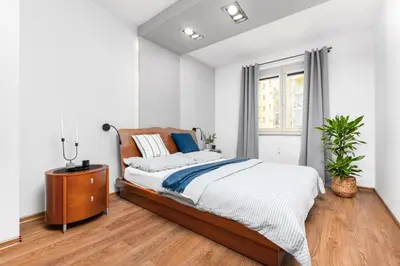 Łóżko lub łóżka w pokoju w obiekcie Apartament Mokotów -basen-