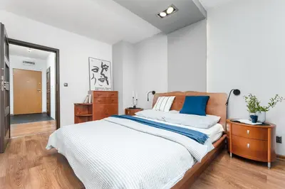 Łóżko lub łóżka w pokoju w obiekcie Apartament Mokotów -basen-