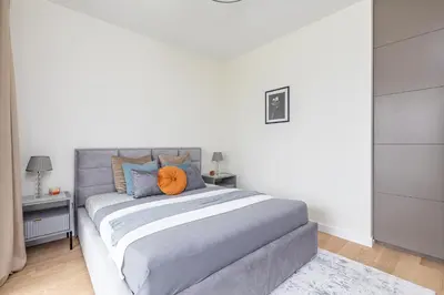 Łóżko lub łóżka w pokoju w obiekcie SuperApart Stanisława Augusta apt 42 - Park Skaryszewski