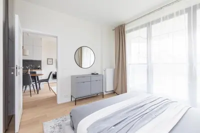 Łóżko lub łóżka w pokoju w obiekcie SuperApart Stanisława Augusta apt 42 - Park Skaryszewski