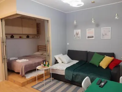 Łóżko lub łóżka w pokoju w obiekcie Studio Głębocka 56