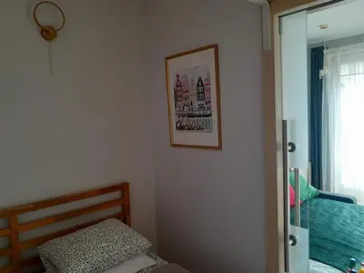 Łóżko lub łóżka w pokoju w obiekcie Studio Głębocka 56