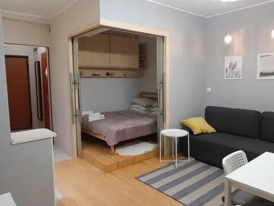Łóżko lub łóżka w pokoju w obiekcie Studio Głębocka 56