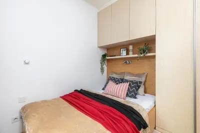 Łóżko lub łóżka w pokoju w obiekcie SuperApart Kolejowa 45 - Nowoczesny apartament na Woli