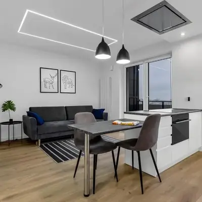 12th Floor Wola Modern Apartment by BookingHost