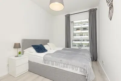 Łóżko lub łóżka w pokoju w obiekcie Business Apartment Mokotów by Noclegi Renters
