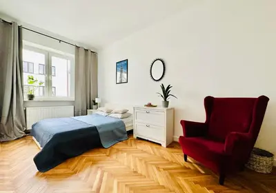 Łóżko lub łóżka w pokoju w obiekcie Baja Apartment Warsaw