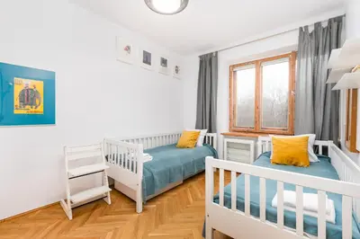 Łóżko lub łóżka w pokoju w obiekcie Dymińska 10A by Homeprime