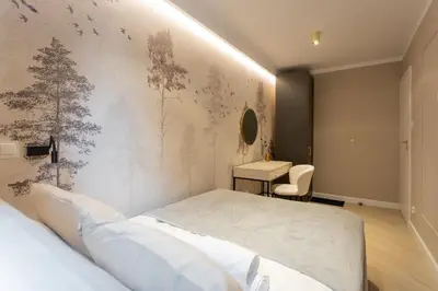 Łóżko lub łóżka w pokoju w obiekcie Grzybowska Rooms by Sofija