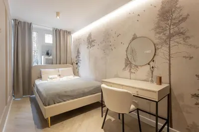 Łóżko lub łóżka w pokoju w obiekcie Grzybowska Rooms by Sofija